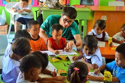 Care placement in Philippines, Asia A volunteer busy teaching children in a care project in Philippines