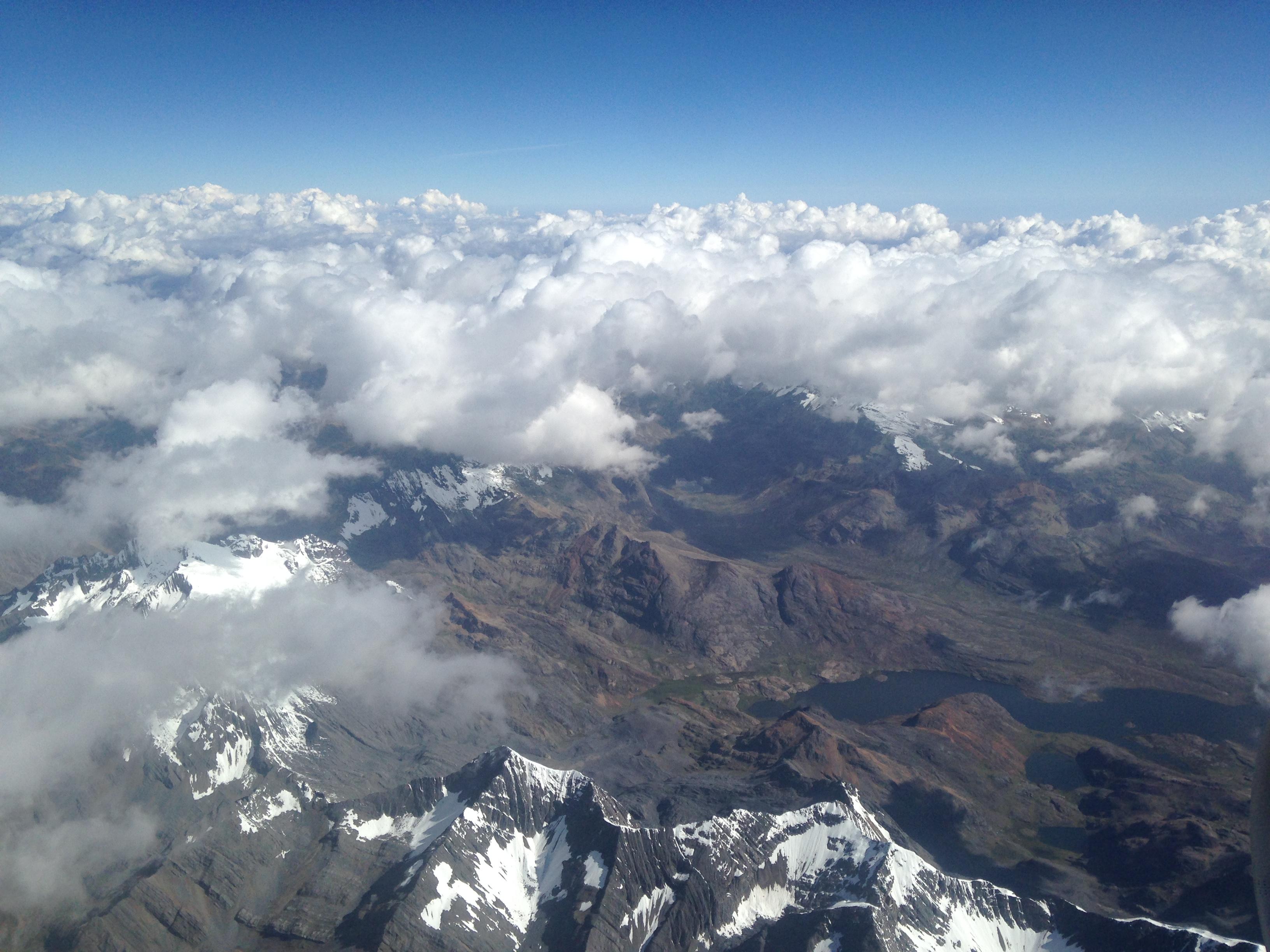 Flying over the snow-capped mountains A view from the plane of the snow-capped Andes Mountains