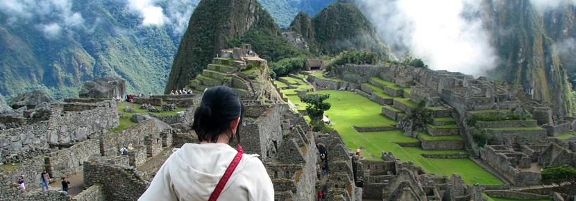 Volunteer at Machu Picchu, Peru Volunteer overlooking the Machu Picchu in Peru, South America